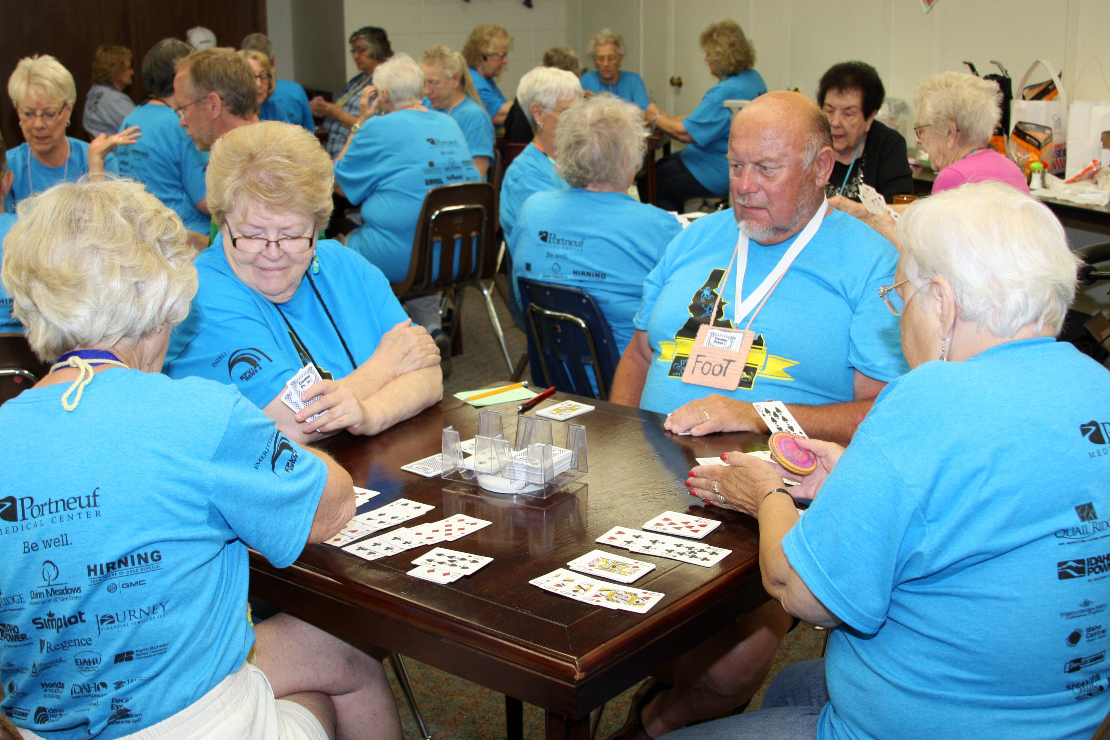 A purple background with the words southeast idaho senior games written in green.